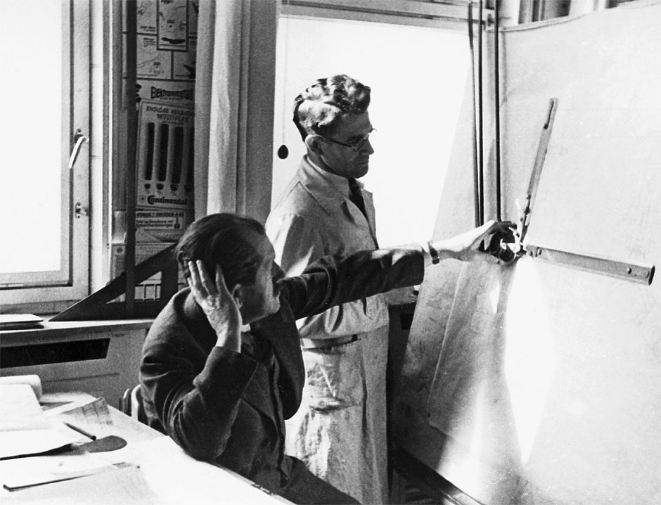 1937. F. Porsche and engine specialist Josef Kales in the Porsche engineering office at Kronenstrasse 24 in Stuttgart.