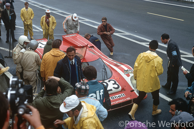 The #23 Porsche 917 KH of Hans Herrmann and Richard Attwood calls into the pits