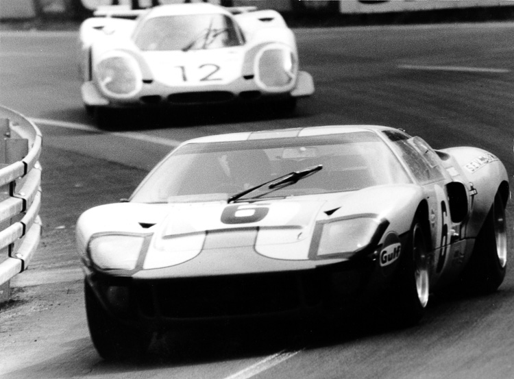 The #6 Ford GT of Jacky Ickx and Jackie Oliver is chased by the #12 Porsche 917 LH of Vic Elford and Richard Attwood