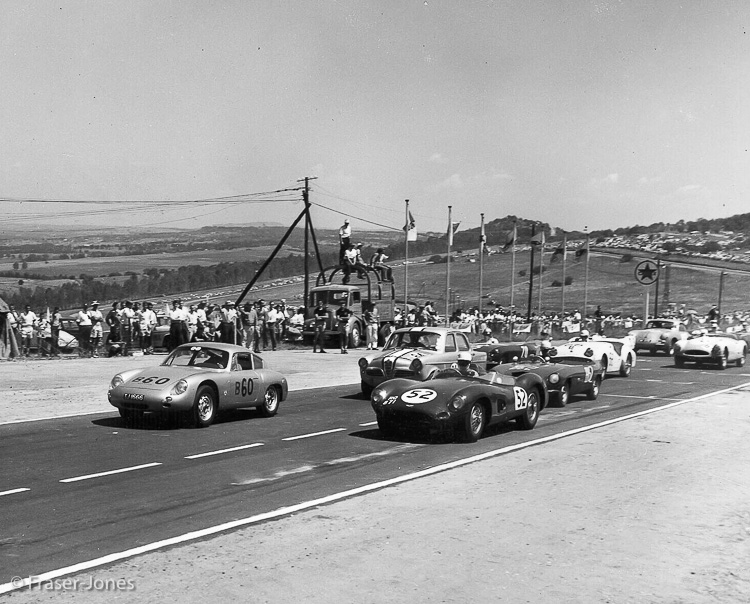 At the start, Ian Fraser-Jones in the #B60 Porsche Carrera GTL Abarth gets the jump on the Aston Martin DBR1!