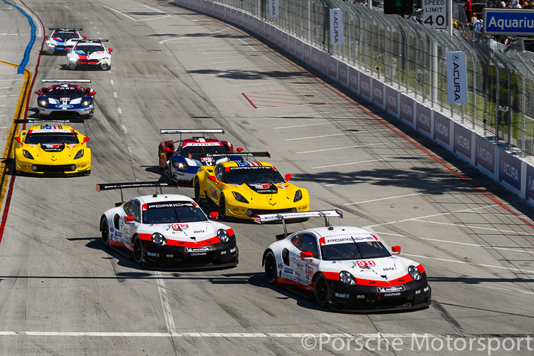 Early in the race, the #911 Porsche GT Team Porsche 911 RSR of Patrick Pilet and Nick Tandy leads the #912 of teammates Earl Bamber and Laurens Vanthoor