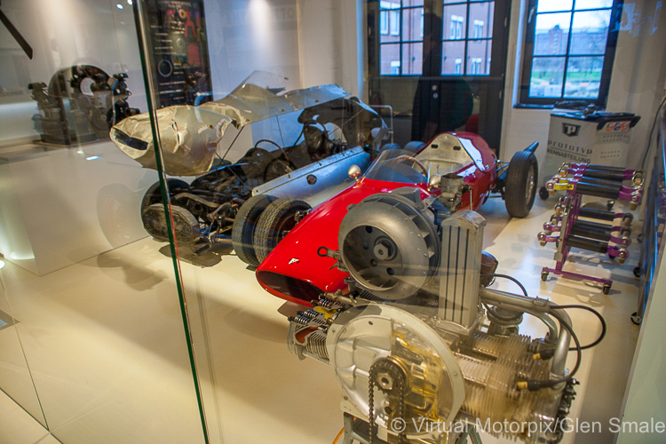 Workshop area with race cars in the process of being rebuilt