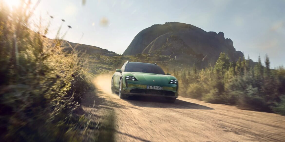 Porsche Taycan driving through desert