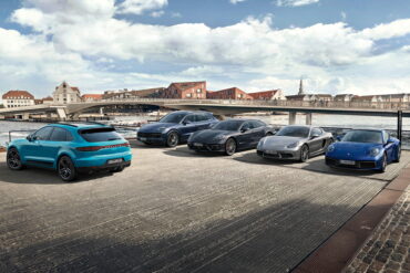 Studio shot of various Porsches outside