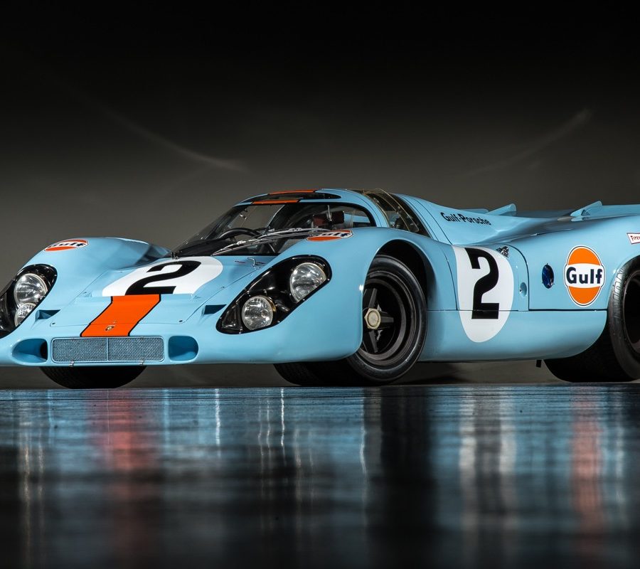 Front-angled view of a Porsche 917 finished with the blue and orange Gulf livery.