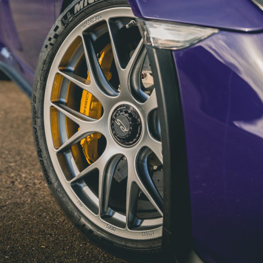 Front wheels on a purple Porsche